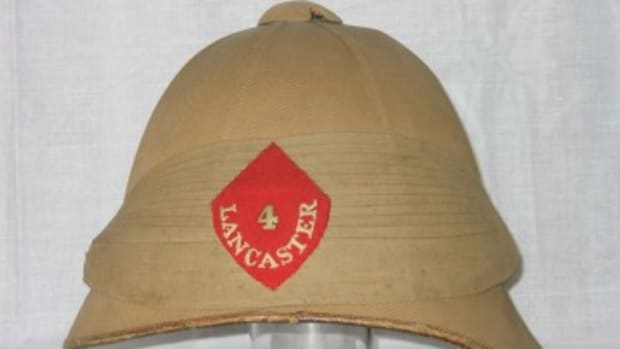 This Boer War helmet was worn by an officer of the 4th (Lancaster) or The King's Own Royal Regiment.