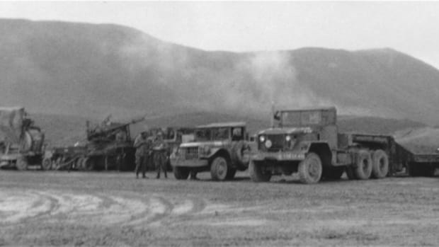  Vietnam veteran, Sp4 David Flinn, 591st Engineers, left us with this photographic record of his unit’s activities in the A Shau Valley. While not professional shots, they provide a unique look into the daily activities of combat engineers. Here, Dave photographed this staging area that shows, right to left, an M123 10-ton tractor attached to M15A1 40-ton trailer, M37 3/4-ton truck, unidentified apparatus on wheels, batch concrete mixer on wheels, and unidentified.