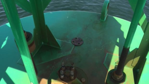  The space in which a sound signaling brass bell typically hangs on this offshore buoy is empty after the bell was stolen, off the coast of Maine. Stealing a sound signaling device off a buoy is a federal offense and can be punishable with heavy fines or even imprisonment. (U.S. Coast Guard courtesy photo)