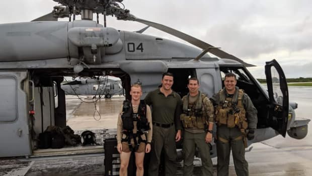  Photo Caption: Photo By Petty Officer 2nd Class Kirsten King | ANDERSEN AIR FORCE BASE, Guam (July 24, 2019) (From Left to Right) Naval Air Crewman (Helicopter) 2nd Class Preston Smith, from Stevens Point, Wisconsin, Naval Air Crewman (Helicopter) 2nd Class Dominic Thomas, from Menominee Falls, Wisconsin, LT Nathan Gordon, from Marietta, Georgia, and LTJG Caleb French from, Amherst, Wisconsin, pose for a photograph after completing a search and rescue mission as part of “Island Knights” of Helicopter Sea Combat Squadron (HSC) 25. HSC-25 provides a multi-mission rotary wing capability for units in the U.S. 7th Fleet area of operations and maintains a Guam-based 24-hour search-and-rescue and medical evacuation capability, directly supporting U.S. Coast Guard and Joint Region Marianas. HSC-25 is the Navy’s only forward-deployed MH-60S expeditionary squadron. (U.S. Navy photo courtesy of HSC-25)
