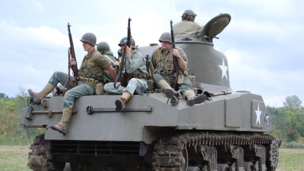 Infantry catching a ride the front on Harold Bottolfson’s M4 medium tank.
