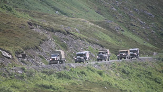 Dodge trucks descending the steep and rough grade after crossing the famous Hatcher Pass.