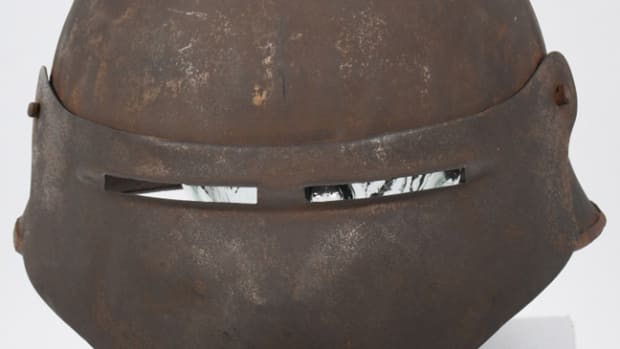  WWI U.S. Model 8 experimental shield, one of approximately 1,300 created by Ford Motor Company in 1918 as a possible replacement to the “doughboy” helmet. One of very few known intact examples.