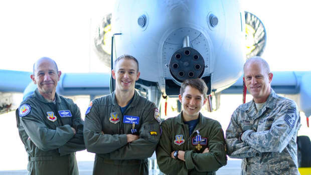  U.S. Air Force Gen. Mike Holmes, Air Combat Command commander, Maj. Tyler Schultz and Capt. Samantha Harvey, 354th Fighter Squadron A-10C Thunderbolt II fighter pilots, and Chief Master Sgt. Frank Batten III, Air Combat Command command chief pose for a picture at Davis-Monthan Air Force Base, Ariz., March 2, 2018. Holmes presented Schultz and Harvey with the Distinguished Flying Cross for conducting an emergency aerial flight in support of U.S. Army forces near Shaddadi, Syria, on May 2, 2017 (U.S. Air Force photo by Giovanni Sims)