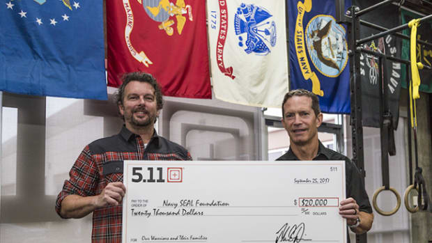  Driessen and 5.11 CEO, Tom Davin, holding the $20,000 check for Navy SEAL Foundation
