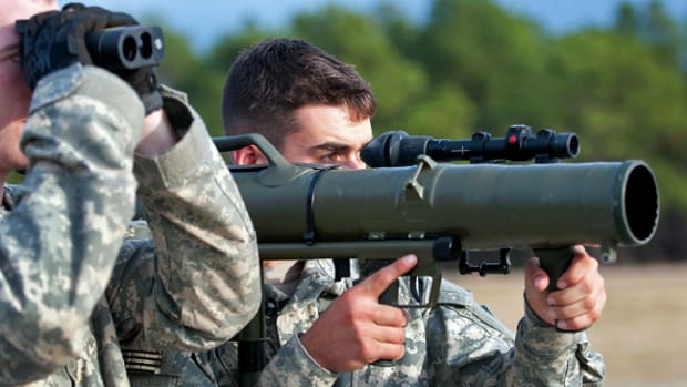 A paratrooper with the 82nd Airborne Division’s 1st Brigade Combat Team shoulders a Carl Gustav M3 84mm recoilless rifle while his partner optically measures the distance to a target during a certification class Dec. 6, 2011, at Fort Bragg, N.C. The paratroopers are preparing for a deployment to Afghanistan. (U.S. Army photo by Sgt. Michael J. MacLeod)