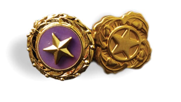 Gold Star Lapel Button (left) are presented to and worn by surviving spouses, parents, and immediate family members of Armed Forces members killed in combat operations. On the reverse is the inscription “United States of America, Act of Congress, August 1966” with space for engraving the initials of the recipient. Next of Kin Lapel Buttons (right) are presented to and worn by immediate Family members of United States Armed Forces members who die while serving outside of combat operations. 