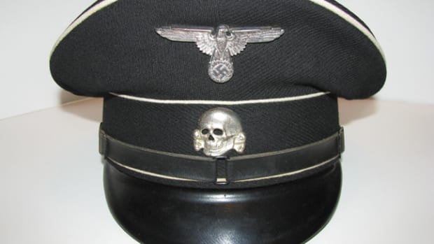  Hitler’s elite members of the Allgemeine SS wore austere, black and white visor caps to incite feelings of pride, discipline, and fear. Mark Pulaski Collection