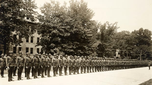  In early 1918, the US War Department created the Student Army Training Corps (SATC) as a way to hasten the training of soldiers for the war. Students in the SATC would simultaneously take college courses and train for the military. The intensive training course at Bliss Electrical School where Maurice Bryant served provided training for electricians. This photo shows SATC drafted men from the Washington, D.C., area installing wires for the electric lights and motors in the wiring laboratory at the school, August 13, 1918. National Archives