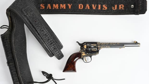 Sammy Davis Jr’s .357 Magnum, 1965, with holster and belt bearing the entertainer’s name. Master engraver Joseph Condon of Las Vegas expertly engraved and added gold inlays of Buffalo Head nickel, coyote, mountain lion, rattlesnake and more. Sold within estimate for $16,800.