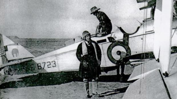 Wing Commander R.C.M. Pink, CBE next to DH9A E8723 of 27 Squadron.