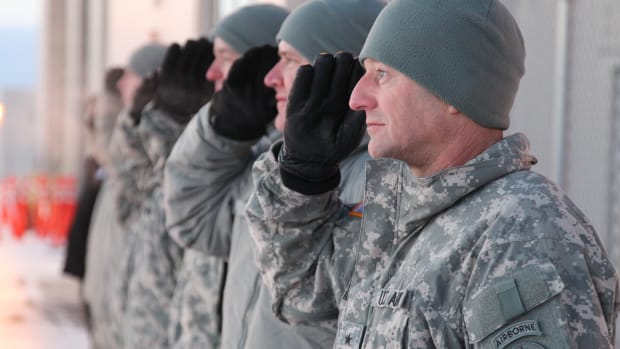 USARAK commander Gen. Raymond Palumbo is wearing the old-style rectangular tab as he stood at attention in -23 degrees temperature, rendering a salute as U.S. Army Chief of Staff, Gen. George Casey, departed Alaska in December 2010.