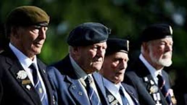 British World War II veterans visit the war cemetery of Ranville, northwestern France, on June 4, 2014.