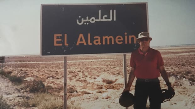 The author with helmets found at El Alamein. All items shown here were surface finds.