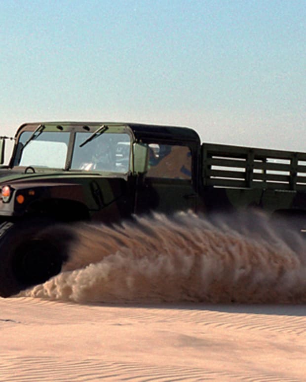 Humvee driving in the sand