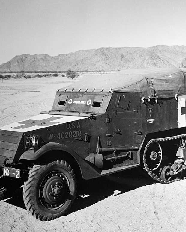 An M3 half-track converted to use as an armored ambulance was photographed at a desert base. This vehicle was U.S. Army registration number 4028218. The entire top of the hood was painted white with the Red Cross superimposed.