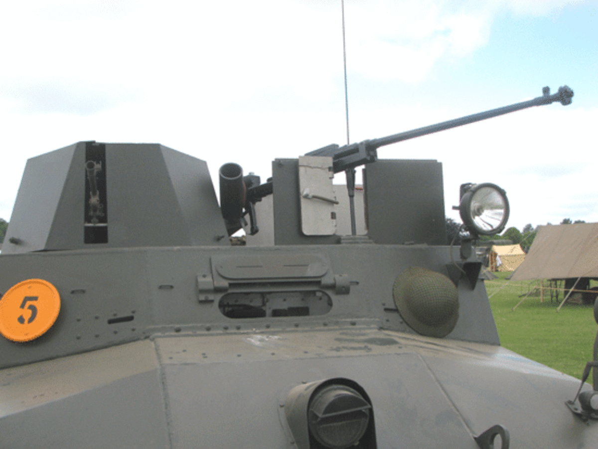 p.p1 {margin: 5.0px 0.0px 5.0px 0.0px; text-align: justify; font: 9.0px Univers}    Detail of weaponry carried on the Morris LRC. To the left is the muzzle of the Bren Gun protruding from turret and to the right is the hefty Boys anti-tank rifle. In the center can be seen the smoke grenade launcher.