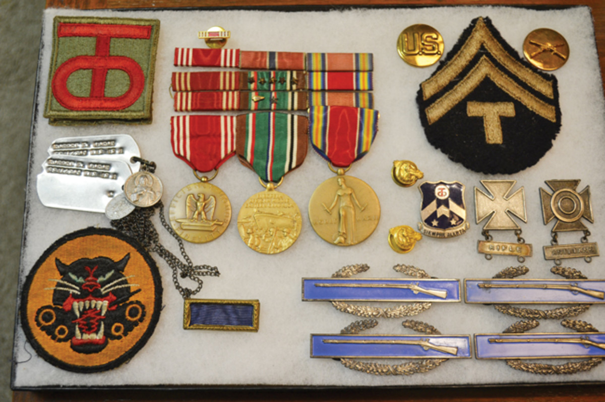  Robert F. Goron had been a Technician Fifth Grade with the Headquarters Company, 3rd Battalion 357th Infantry Regiment of the 90th Division during WWII. Much of his military career is reflected in the collection of patches, insignia, and medals that I acquired more than 40 years after having first met Mr. Goron.