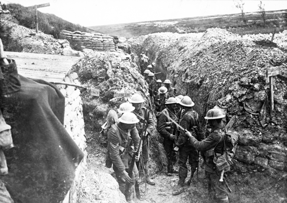 Early on the morning of 1 July 1916 at Beaumont Hamel men of the 1st Lancashire Fusiliers fix bayonets before proceeding to the front line. Trenches were named, many after London streets, and here the men stand in Esau’s Way and will proceed to the left along King Street taking them to the British Front Line.