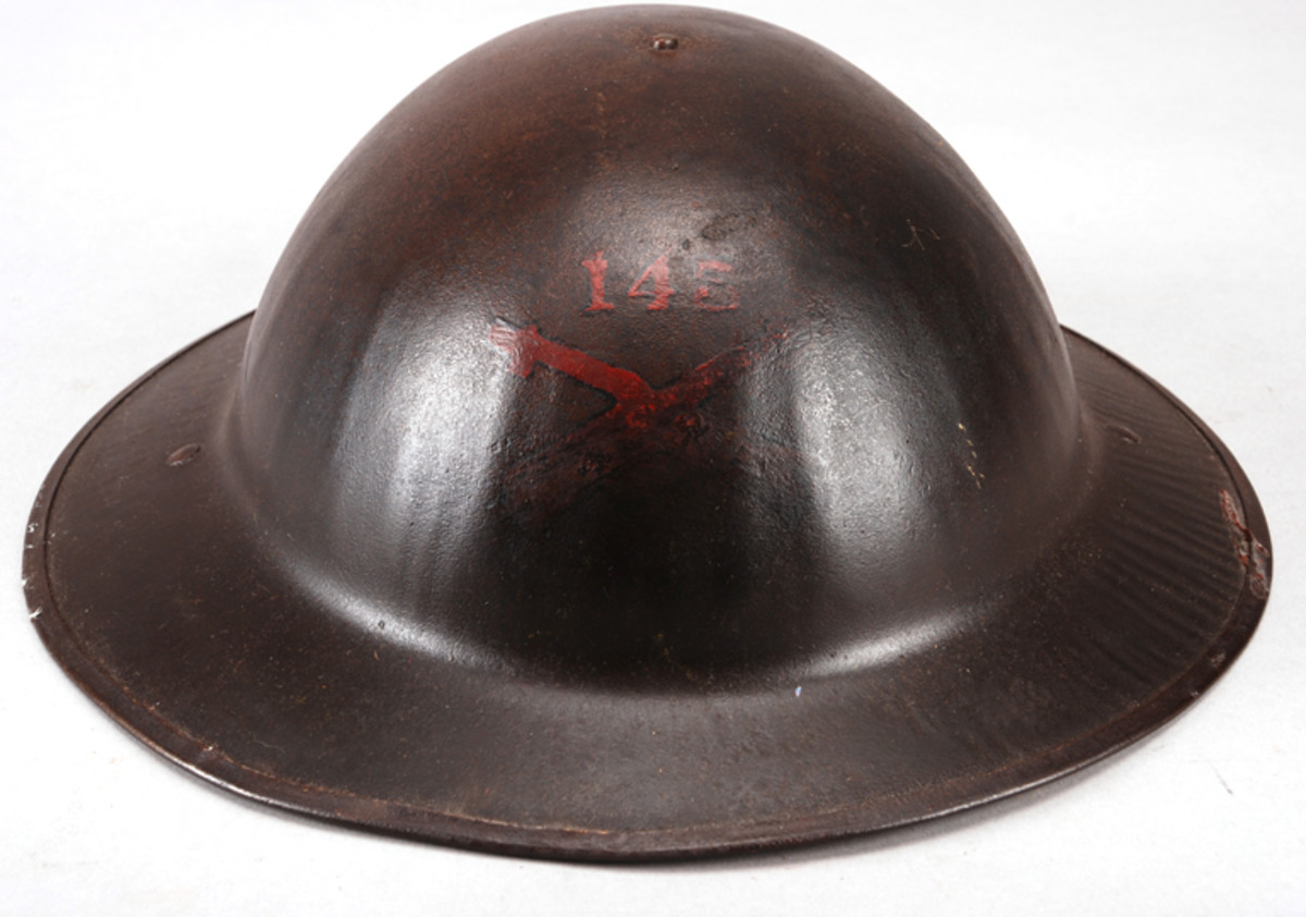 WWI helmet with exterior unit markings obscured by a varnish overcoat.