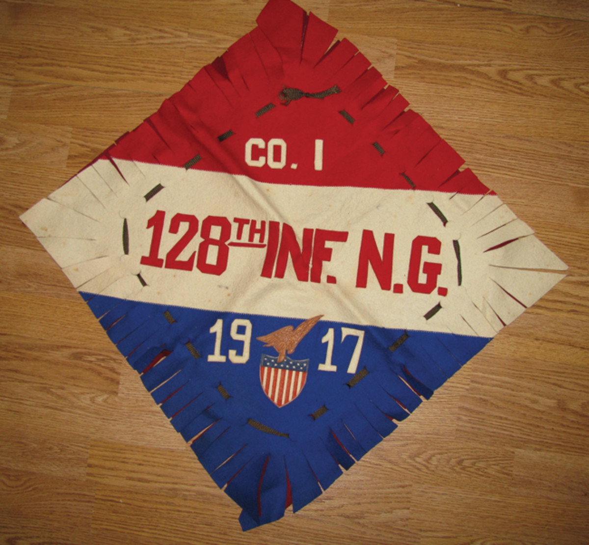  WWI multi-piece covers featured unit designations, such as the 128th Infantry, National Guard-decorated piece.