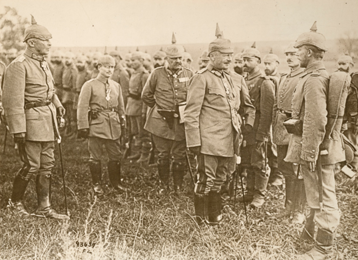  While giving final instruction before going into the fray, the King of Saxony is seen conversing with one of his men who has just received an Iron Cross.