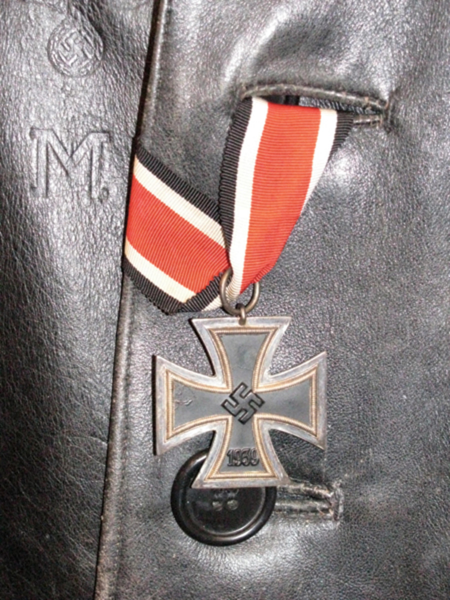  When first awarded, the ribbon of a Second Class Iron Cross was tucked through the second button hole of the recipient’s tunic (this example is on a naval leather coat).