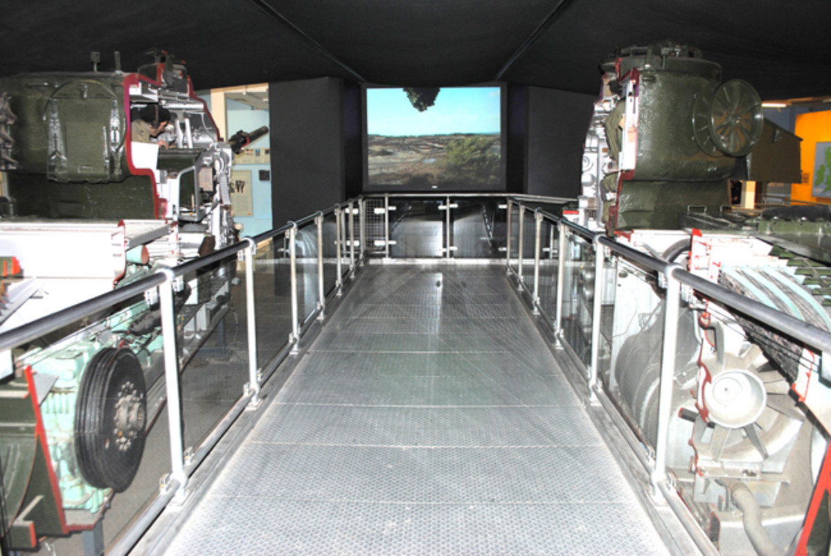 A well-known exhibited of a bisected Centurion tank is incorporate in the new exhibit. Visitors enter between the two tank halves and view crew interaction on television monitors. 