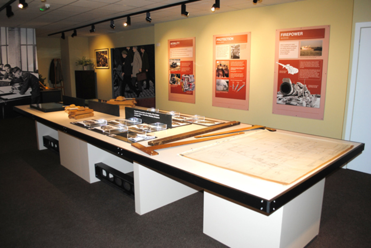 The recreated technical drawing room invites visitors to examine original tank blueprints and study wooden models.