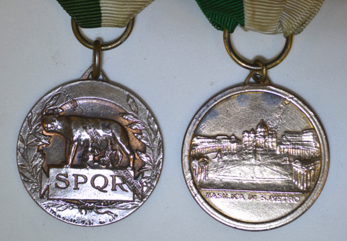  The Rome Liberation Type 2 medal has the symbol of Rome Romulus & Remus on the obverse while the Type 3 medal shows St. Peter’s Basilica. Both have bright finishes.
