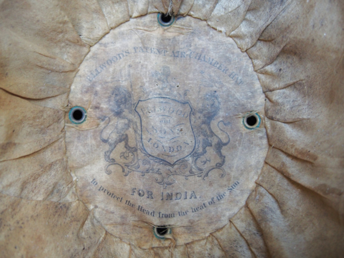 A view of the Ellwood & Sons’ makers label inside the helmet shows that this helmet was essentially designed “For India to protect the Head from the heat of the Sun.”
