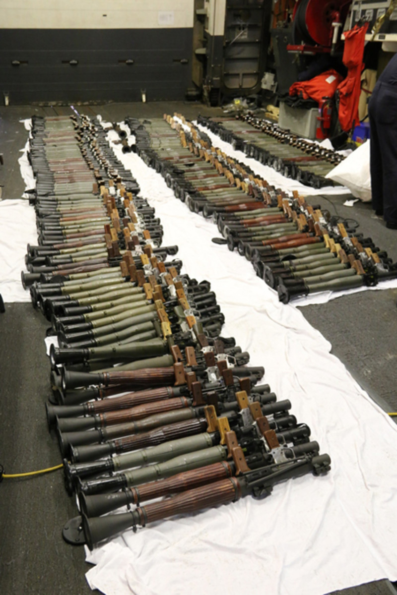  A cache of weapons is assembled on the deck of the guided-missile destroyer USS Gravely (DDG 107). The weapons were seized from a stateless dhow which was intercepted by the Coastal Patrol ship USS Sirocco (PC 6) on March 28. The illicit cargo included 1,500 AK-47s, 200 RPG launchers, and 21 .50 caliber machine guns. Gravely supported the seizure following the discovery of the weapons by Siroccoís boarding team. This seizure was the third time in recent weeks international naval forces operating in the waters of the Arabian Sea seized a shipment of illicit arms which the United States assessed originated in Iran and was likely bound for Houthi insurgents in Yemen. The weapons are now in U.S. custody awaiting final disposition. (U.S. Navy Photo/Released)