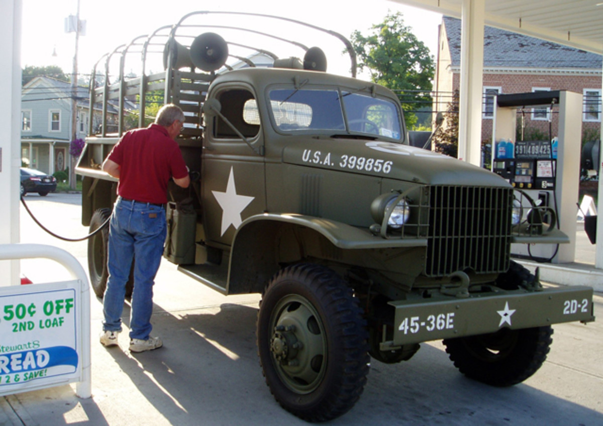 Photo of a collector filling the gas on a G-506 restored truck.