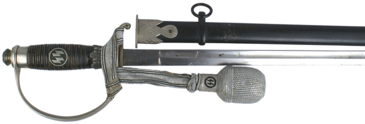 Nazi SS officer's dress sword with wire-wrapped wood grip and original SS officer's silver bullion portopee ($7,931).