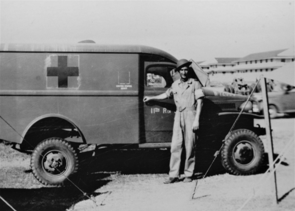 Barksdale Field, LA, summer 1941. Private (later Sergeant) Louis Sigrist with his newly arrived ride, a 1941 Dodge Army Air Corps Ambulance.