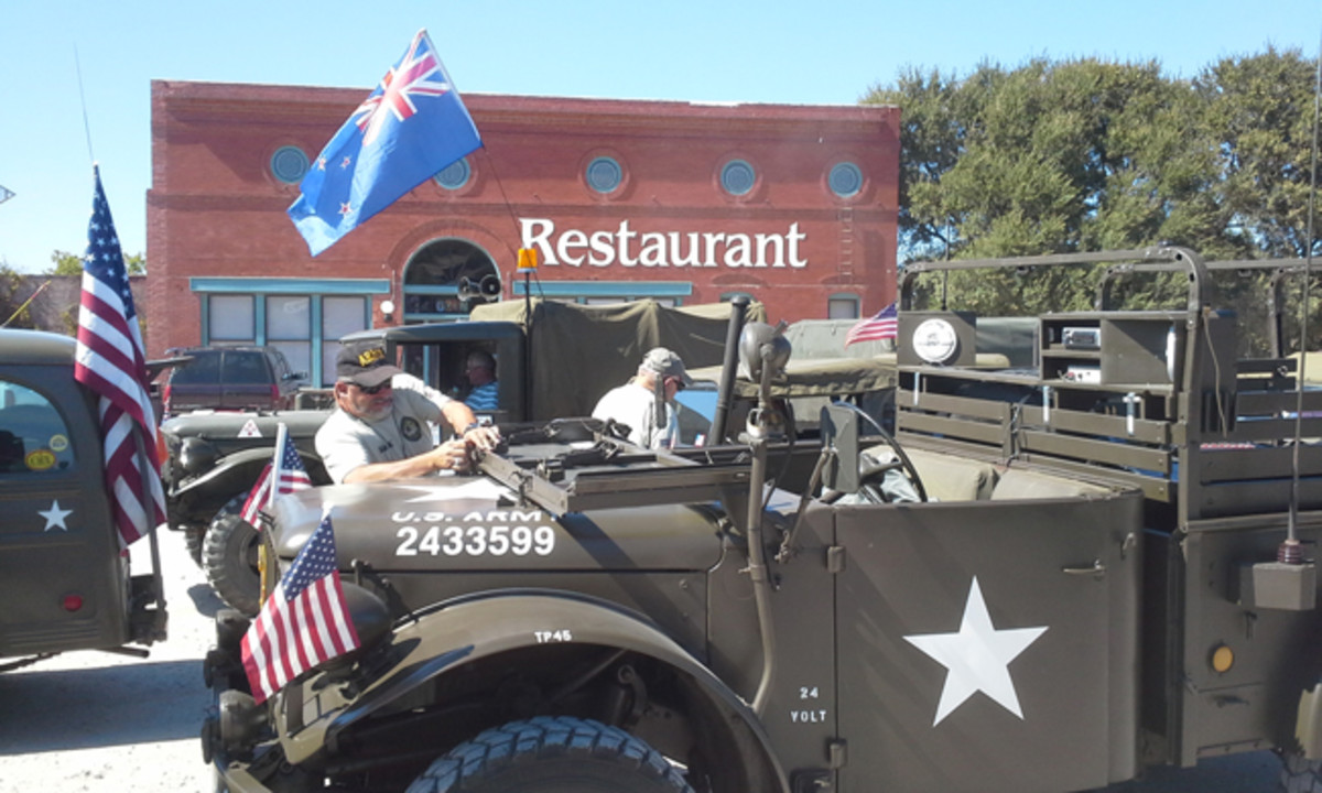 At Thubor Texas rest stop. M37 and jeeps. In foreground was retired col. Mark Koloc locking down his windshield. He drove much of the convoy with the top and windshield down.