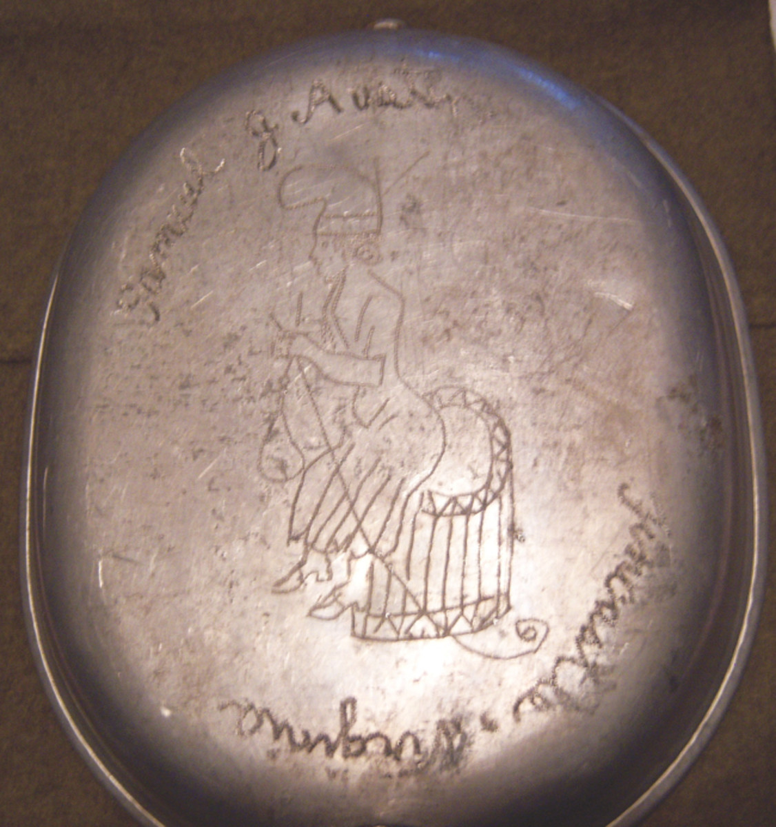  Less artistic than his fellow Virginian Sgt. Barney, Samuel J. Austin, from the very small town of Fincastle, Virginia, managed to carve a crude image of Betsy Ross sewing the first US flag on the pan portion of his mess kit.