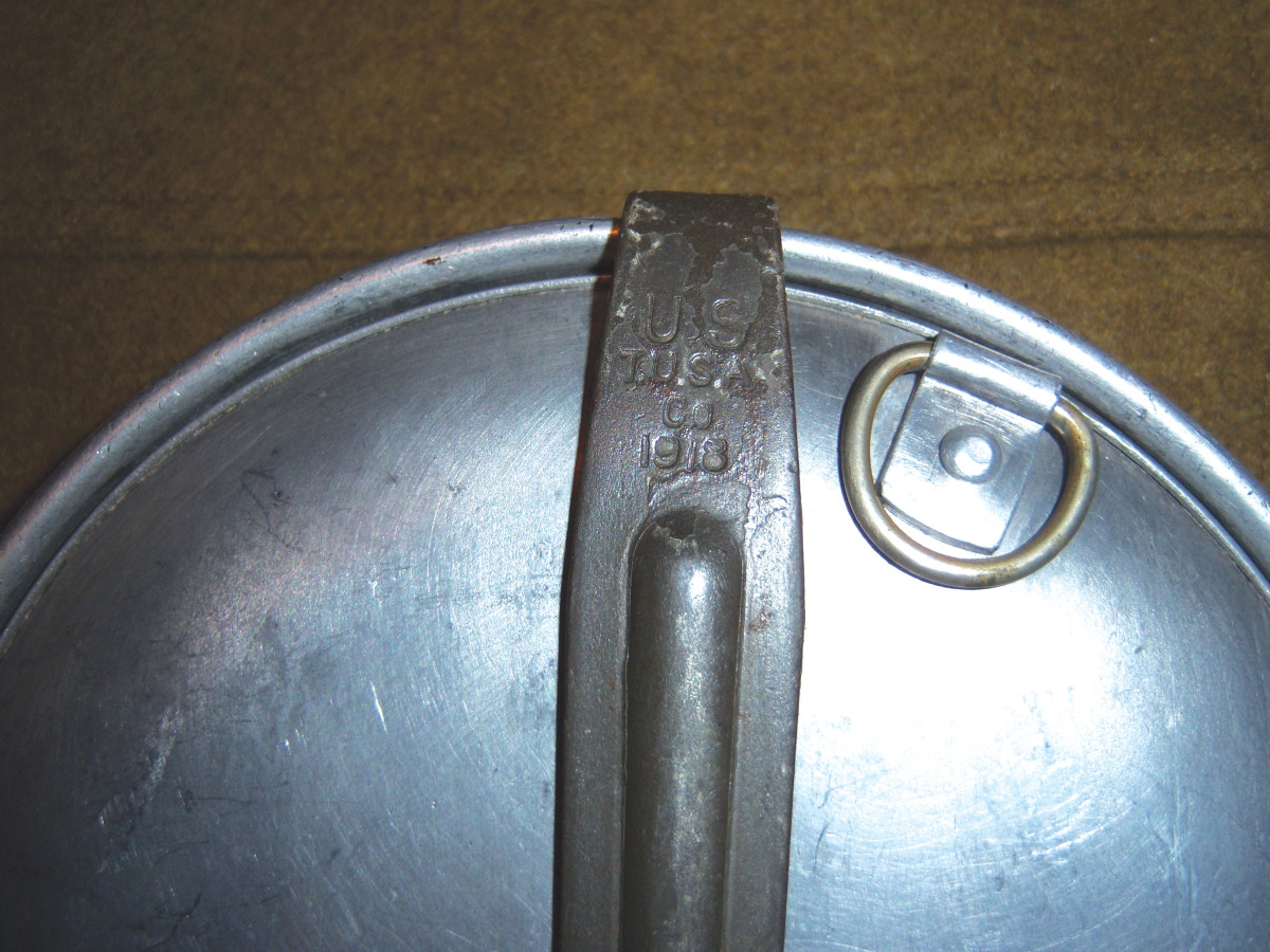  One discouraging factor in researching and collecting mess kits is that heavy use and rough handling often makes the manufacturer’s initials and date extremely difficult to read as shown by this example.