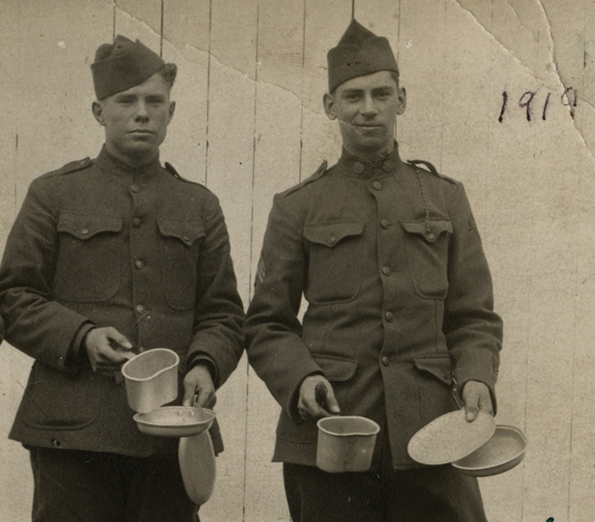  Sgt. Bert Fidler (on right), 39th Infantry Regiment, 4th Division, poses with a friend and his new mess kit. He wrote home and talked about machine gun fire “riddling my pack. The mess kit in my pack was shot full of holes, my corn willy and hard tack was shot to pieces and I didn’t have anything to eat for nearly 3 days.” Courtesy Matt Fidler
