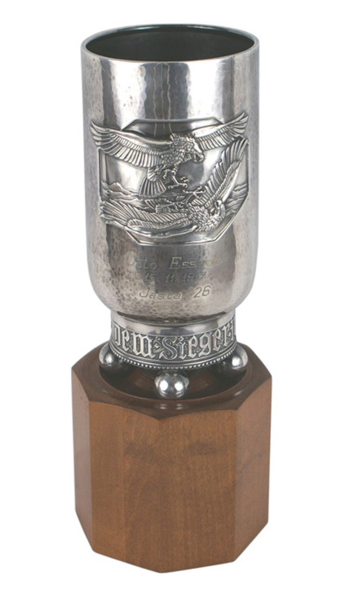 Imperial German World War I fighter pilot’s “pokol” (or silvered victory goblet), showing an embossed panel of two eagles in combat, 7 inches tall.