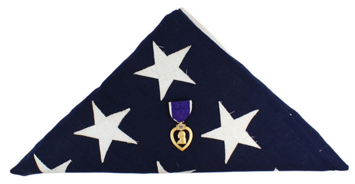 Purple Heart awarded to Cpl. Joseph E. Oleskiewicz – a member of the “Filthy Thirteen” in World War II ($5,100).