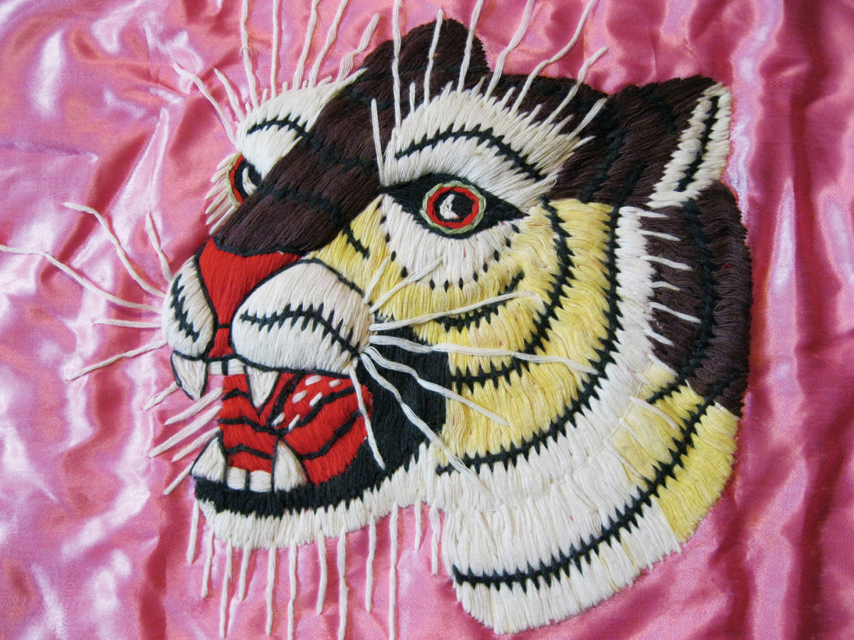  The level of craftsmanship that can be found on wall hangings can clearly be seen on this example. Most do not exhibit this much detail that includes a red tongue, long whiskers and a three-dimensional effect around the nose.