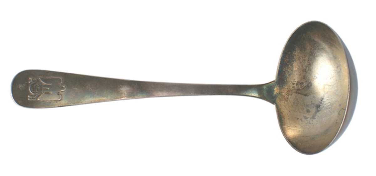 Silver gravy ladle with relief eagle/swastika over an Adolf Hitler “AH” monogram ($2,232).