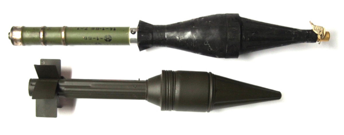 A pair of rocket-propelled grenades (RPGs): The top one a deactivated RPG-7 training round. The bottom is an inert RPG-2 round. Neither has a charge. Therefore, they are not considered destructive devices.