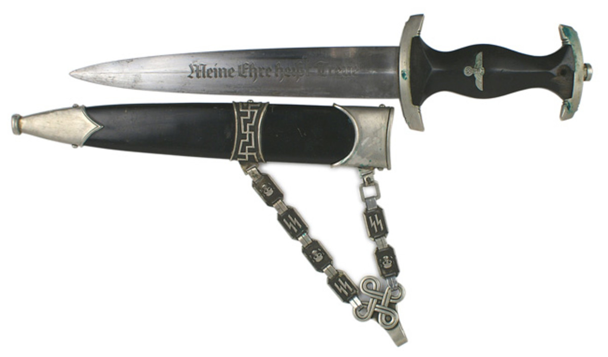  German SS officer’s chained dagger with a black wood grip and an age toned silvered eagle-swastika insignia ($3,600).
