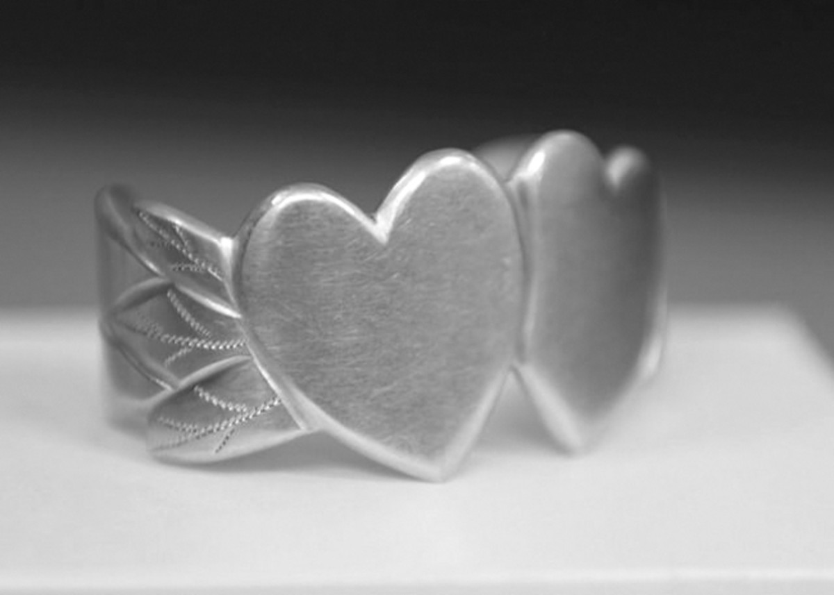  With two united hearts symbolizing his love for Clara, Leon M. Larson of the 63rd Naval Construction Battalion used salvaged aluminum from a downed plane to fashion this bracelet sometime after the Battle of Guadalcanal. US Navy Seabee Museum, Port Hueneme, Calif., Naval History and Heritage Command