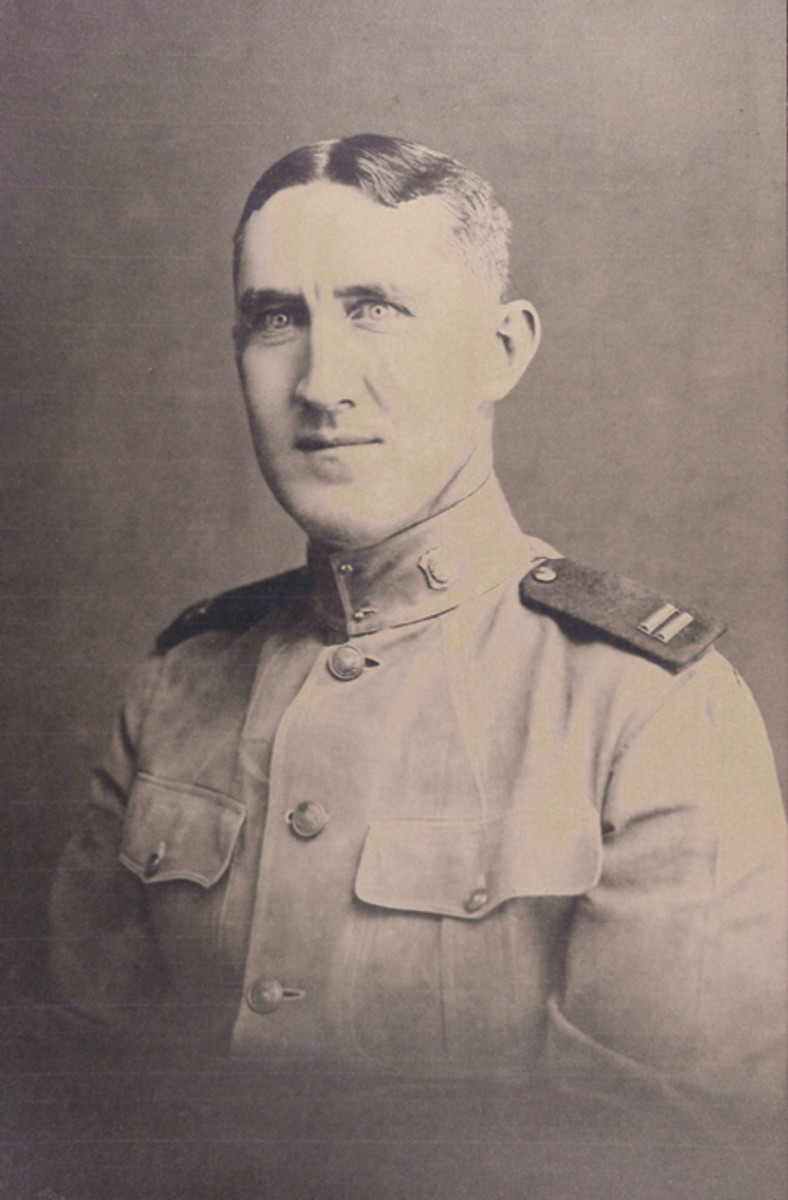  Captain Obie Newton, ca. 1918 wearing a cotton tunic with red detachable shoulder straps. The insignia on his standing collar is the gold shield with large, silvered letters “PC” surrounding the Philippine coat of arms. This style of officer’s insignia was in use from 1905-1922.
