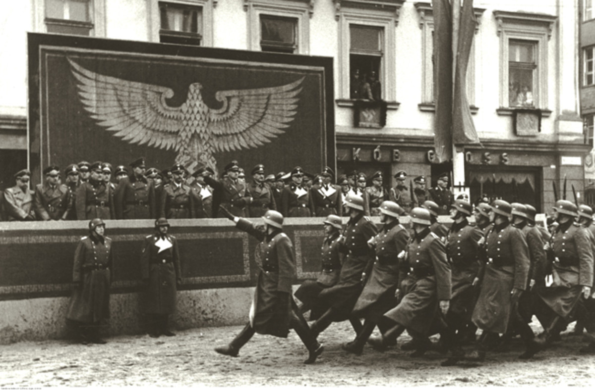  Police formations march past dignitaries in Krakow, including Heinrich Himmler and Hans Frank. When dressed for such occasions, some German NCOs and enlisted soldiers would wear brass or wood handled “dress” bayonets decorated with colored tassels that designated their individual units.