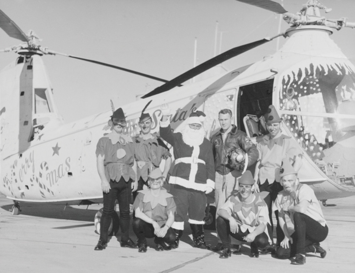 Santa and elves arrive by special helicopter for a children’s Christmas party at Naval Air Station Oakland, 23 December 1956.