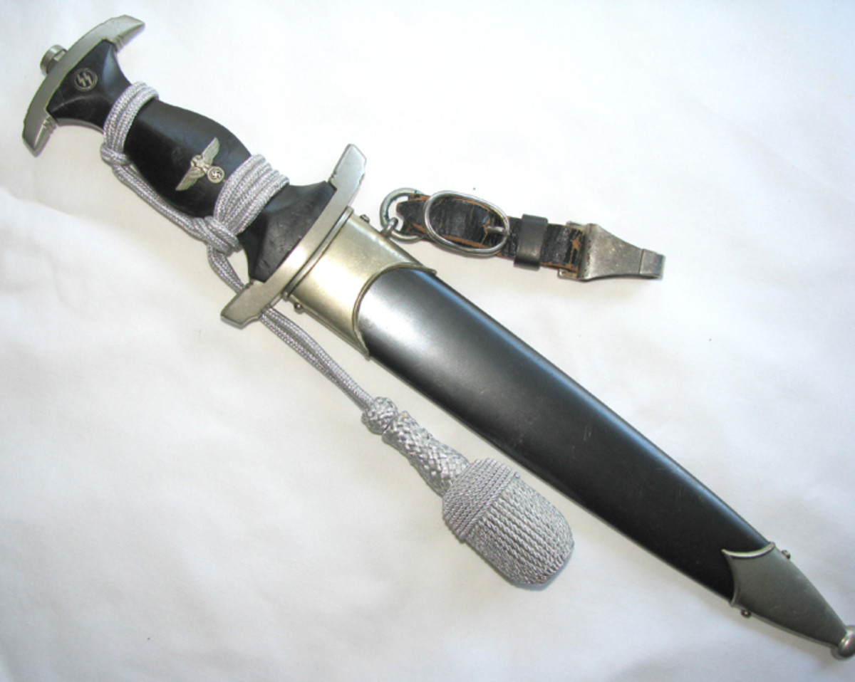 The model 1933 SS dagger could be wrapped with a silver portepee and hung from a black leather and silver strap.